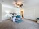 Spacious bedroom with carpeted floor, ceiling fan and large closet at 3005 Enisglen Dr, Palm Harbor, FL 34683