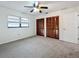 Bright bedroom with double closets and carpet at 3005 Enisglen Dr, Palm Harbor, FL 34683