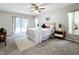 Main bedroom with patio access and modern decor at 3005 Enisglen Dr, Palm Harbor, FL 34683