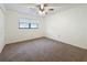 Bedroom with ceiling fan and carpet at 3005 Enisglen Dr, Palm Harbor, FL 34683