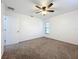 Simple bedroom with ceiling fan and carpet at 3005 Enisglen Dr, Palm Harbor, FL 34683