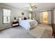 Main bedroom with barn doors to en-suite bath at 3005 Enisglen Dr, Palm Harbor, FL 34683