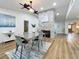 Modern dining area with grey table and chairs near fireplace at 3005 Enisglen Dr, Palm Harbor, FL 34683