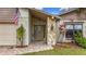 Inviting entryway with a stone accent wall and a brick walkway at 3005 Enisglen Dr, Palm Harbor, FL 34683