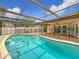 Enjoy this refreshing kidney-shaped pool at 3005 Enisglen Dr, Palm Harbor, FL 34683