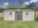 Large storage shed with double doors and window accents at 3005 Enisglen Dr, Palm Harbor, FL 34683