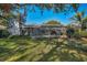 House with a large backyard, screened pool and patio at 3147 Hyde Park Dr, Clearwater, FL 33761