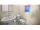 Clean guest bathroom with pedestal sink and toilet at 3147 Hyde Park Dr, Clearwater, FL 33761