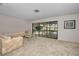 Living room with sliding glass doors leading to pool at 3147 Hyde Park Dr, Clearwater, FL 33761