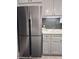 Stainless steel refrigerator in a modern kitchen with white cabinets at 3325 Bayshore Blvd # B21, Tampa, FL 33629