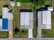 Aerial view of three mobile homes in a community at 36905 Kay Ave, Zephyrhills, FL 33542