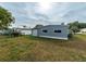 Gray mobile home exterior with storage building at 36905 Kay Ave, Zephyrhills, FL 33542