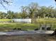 Serene pond with ducks and a bench at 36905 Kay Ave, Zephyrhills, FL 33542