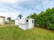 White metal storage shed in grassy backyard at 36905 Kay Ave, Zephyrhills, FL 33542