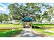 Quaint blue footbridge over a tranquil waterway at 37025 Karen Ave, Zephyrhills, FL 33542