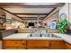 Kitchen sink and view into the living room at 37025 Karen Ave, Zephyrhills, FL 33542