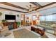 Living room with a couch, armchairs, and a faux fireplace at 37025 Karen Ave, Zephyrhills, FL 33542