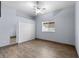 Serene bedroom with wood-look floors and double door closet at 4337 Waterford Landing Dr, Lutz, FL 33558