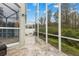 Screened patio with tiled floor and view at 4337 Waterford Landing Dr, Lutz, FL 33558