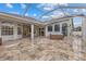 Enclosed patio with hot tub and expansive tile flooring at 4337 Waterford Landing Dr, Lutz, FL 33558