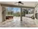 Large screened patio with hot tub and tile flooring at 4337 Waterford Landing Dr, Lutz, FL 33558