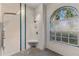 Large walk-in shower with tile surround and built-in seat at 4337 Waterford Landing Dr, Lutz, FL 33558