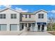 Townhome exterior with a blue awning, light gray siding, and a single-car garage, showcasing modern design at 4648 Pleasant Ave, Palm Harbor, FL 34683