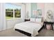 Bright bedroom with window seat and a view of the backyard at 5028 124Th E Ave, Parrish, FL 34219