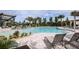 Luxury pool area with lounge chairs and umbrellas at 5028 124Th E Ave, Parrish, FL 34219