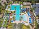 Community pool and amenity area with large pool and water slide at 5110 San Martino Dr, Wesley Chapel, FL 33543