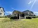 Townhome with a screened patio and grassy backyard at 5110 San Martino Dr, Wesley Chapel, FL 33543