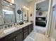 Double vanity bathroom with granite countertops at 5110 San Martino Dr, Wesley Chapel, FL 33543