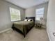 Bright bedroom with a comfortable bed and ample natural light at 5110 San Martino Dr, Wesley Chapel, FL 33543