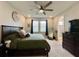 Main bedroom with a king-size bed and en-suite bathroom at 5110 San Martino Dr, Wesley Chapel, FL 33543