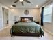 Main bedroom with king-size bed, and large windows at 5110 San Martino Dr, Wesley Chapel, FL 33543