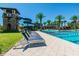 Community pool with a waterslide and plenty of lounge chairs at 5110 San Martino Dr, Wesley Chapel, FL 33543