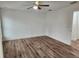 Bright bedroom with hardwood floors and ceiling fan at 5211 Peach Ave, Seffner, FL 33584