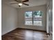 Bright bedroom with wood-look floors and a large window at 5211 Peach Ave, Seffner, FL 33584