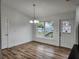 Simple dining area with hardwood floors and a view to backyard at 5211 Peach Ave, Seffner, FL 33584