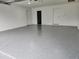 Garage with epoxy floor and interior access at 5211 Peach Ave, Seffner, FL 33584