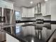 Modern kitchen featuring stainless steel appliances and sleek countertops at 5211 Peach Ave, Seffner, FL 33584