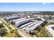 Wide aerial view of community featuring multiple buildings and landscaping at 5705 80Th N St # 210, St Petersburg, FL 33709