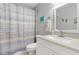 Clean bathroom with white vanity, stone countertop, and shower/tub combo at 5705 80Th N St # 210, St Petersburg, FL 33709