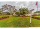 Landscaped entrance to the community with a bus stop at 5705 80Th N St # 210, St Petersburg, FL 33709