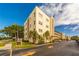 Condo building with landscaping and street view at 5705 80Th N St # 210, St Petersburg, FL 33709