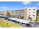 Condo building with covered parking and landscaping at 5705 80Th N St # 210, St Petersburg, FL 33709