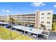 Condo building with covered parking and landscaping at 5705 80Th N St # 210, St Petersburg, FL 33709