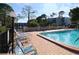 Relaxing pool area with lounge chairs and a tranquil atmosphere at 5705 80Th N St # 210, St Petersburg, FL 33709