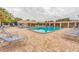 Community pool with plenty of lounge chairs for relaxing at 5705 80Th N St # 210, St Petersburg, FL 33709