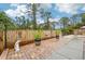 Brick paved patio with wooden fence and potted plants at 5780 Elton Rd, Venice, FL 34293